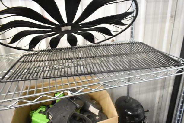 Metal wire rack with decorative black fan design and items in box below. Good condition. Auction includes two items.