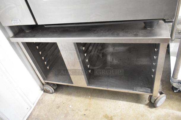 Rational stainless steel commercial gas combi convection oven on equipment stand, sturdy build, slight wear visible.