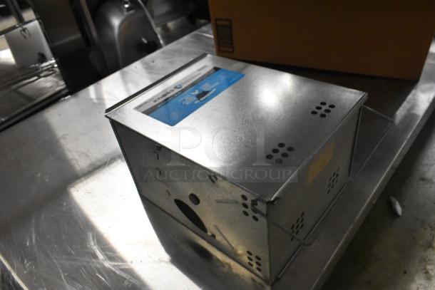 Kness Pest Defense Rodent Mousetrap, metal construction, ventilation holes, visible label, in good condition.