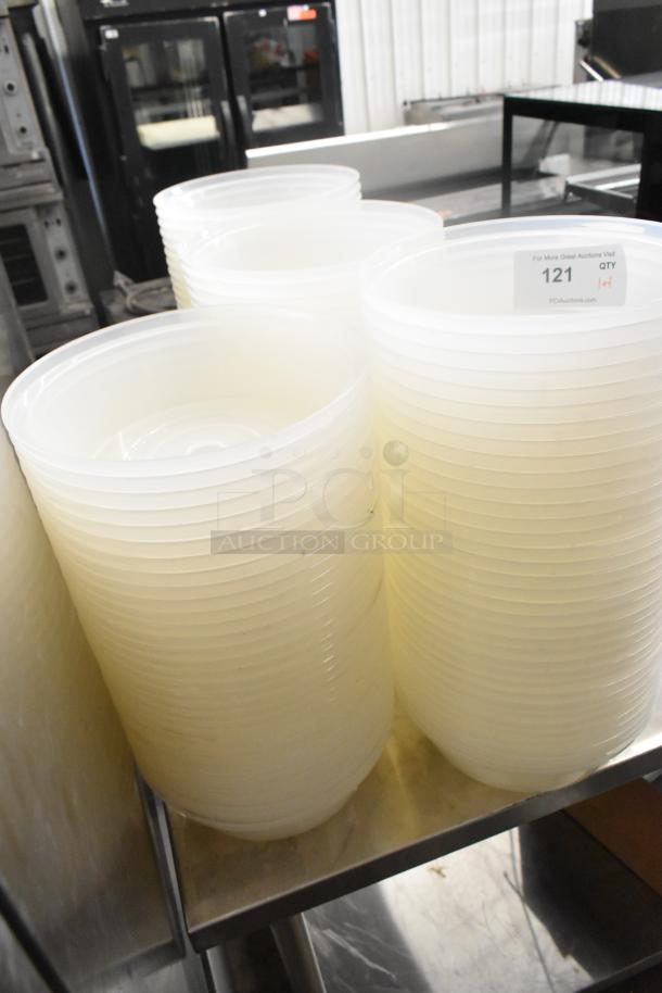 Lot of poly dome covers, stacked, in good condition; label shows auction item number 121.