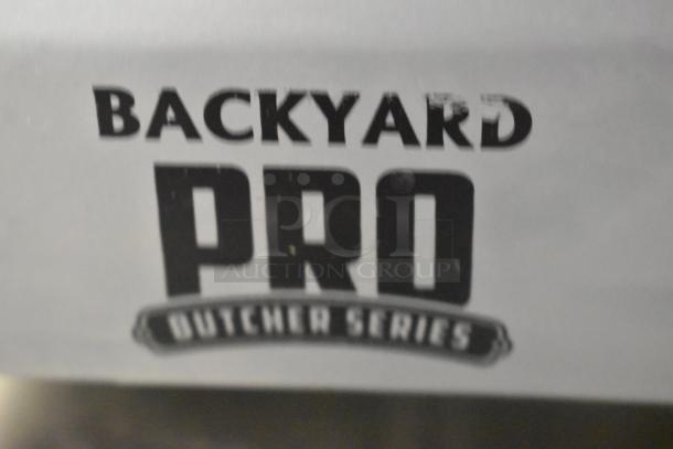 Backyard Pro 554SL110E stainless steel commercial meat slicer, 115V, with blade sharpener.