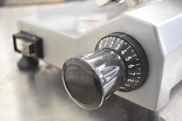 Backyard Pro 554SL110E stainless steel meat slicer with blade sharpener, voltage dial visible. Excellent commercial condition.