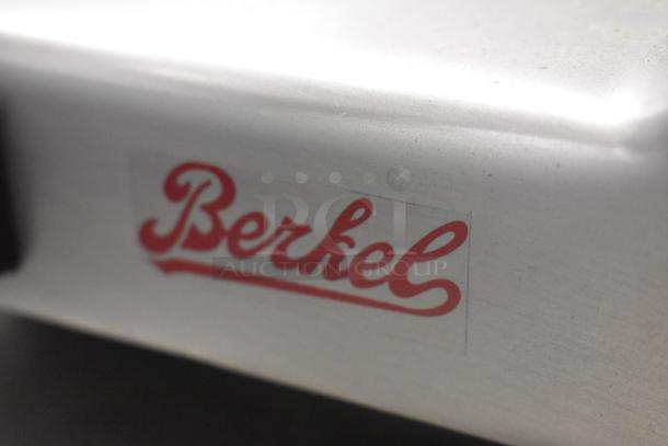 Berkel B9-SLC meat slicer close-up, showing the stainless steel finish and brand logo.