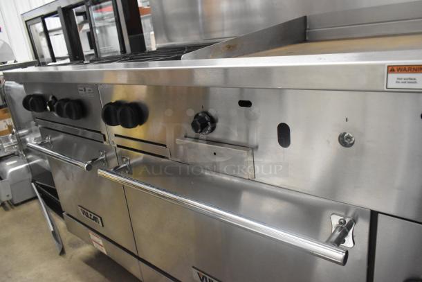 Vulcan 60SS-6B24GTN stainless steel gas range with 6 burners, flat top griddle, 2 ovens, shelf, backsplash, on casters.