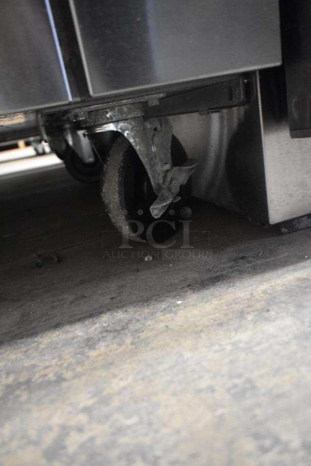 Vulcan 60SS-6B24GTN commercial range caster, showing stainless steel finish and durable wheel for mobility.
