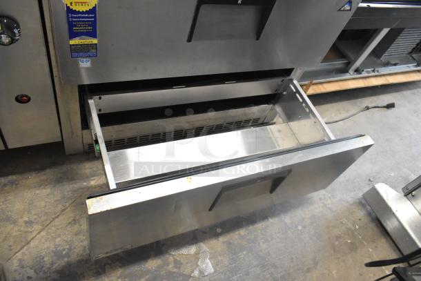 Everest ETSSR2-D2 stainless steel 2-drawer cooler, 115 volts, 1 phase. Features visible warranty label. Slight wear shown.