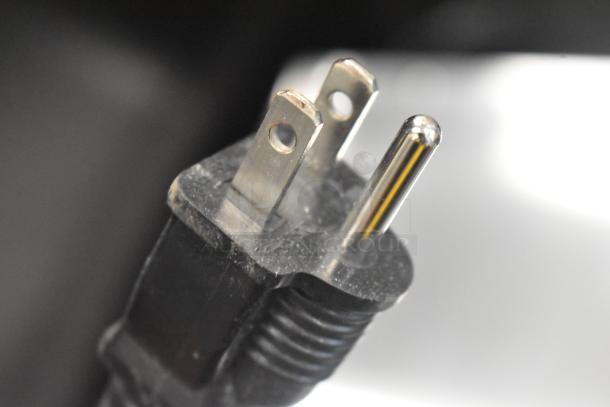 Close-up of a power cord plug for the Cooking Performance Group CPG 351CHCT1A Cook and Hold Oven, 120V, 1 Phase.