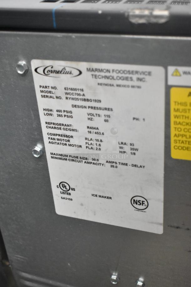 Cornelius WCC700-A ice maker label showing specifications: 115 volts, 1 phase, R404A refrigerant. UL and NSF certified.