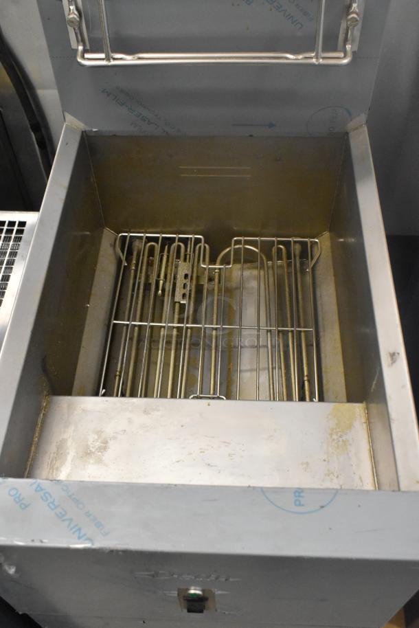Brand new Frymaster SR114ESD stainless steel electric fryer, features 2 fry baskets, visible scratch and dent, 240V, 3-phase.