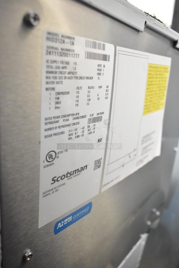 BRAND NEW SCRATCH AND DENT Scotsman HID312A-1A ice machine, stainless steel, 12 lb. storage, 115V, 1 phase, labels visible.