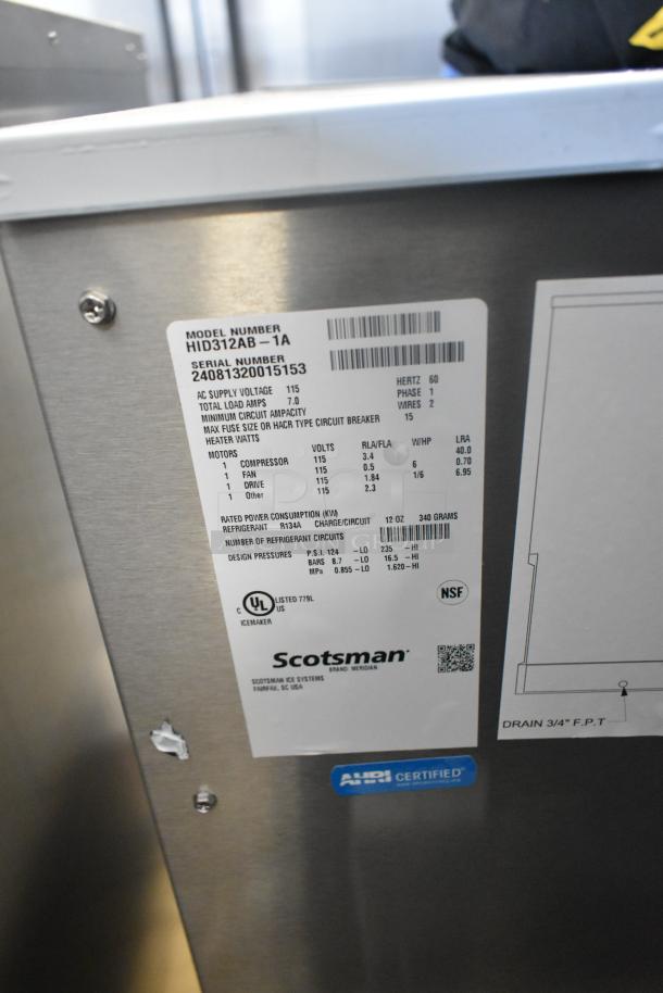 Stainless steel Scotsman HID312AB-1A countertop ice machine, new with tags. Holds 12 lbs, 115V. Scratch and dent model.