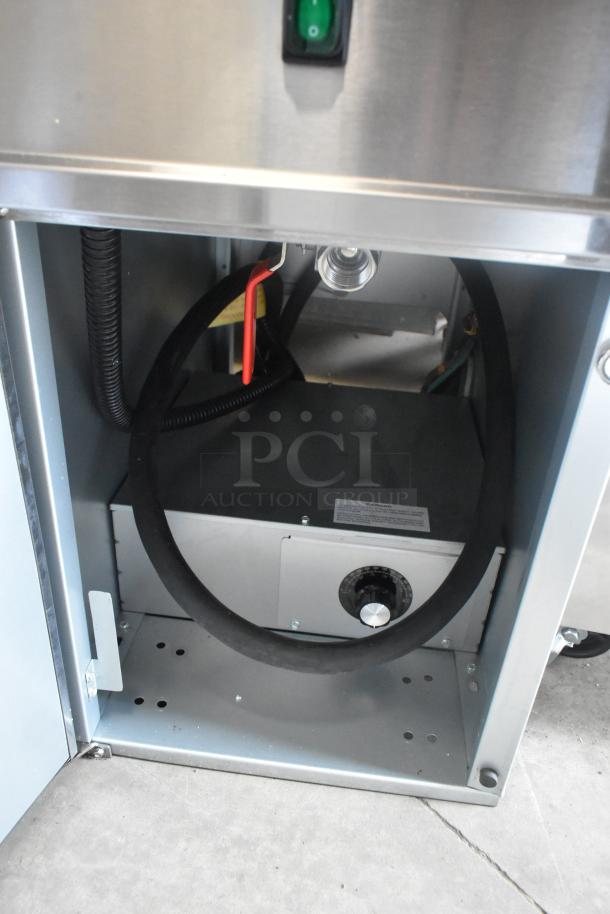 Brand new Avantco 177EF40E stainless steel commercial deep fat fryer, electric, with internal view showing wiring and components.