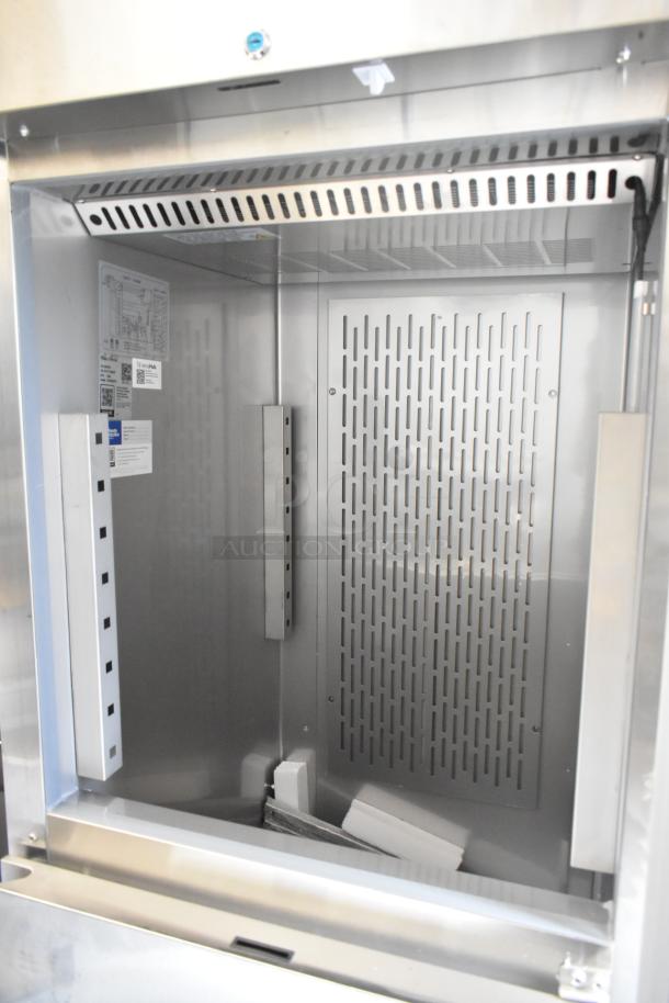 Brand new Avantco 178Z1F2A stainless steel commercial reach-in freezer, 2 half doors, 115V, 1 phase, minor scratches.