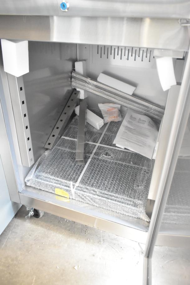 BRAND NEW Avantco 178Z1F2A stainless steel commercial freezer, two half-size doors, 115V, 1 phase, scratch and dent condition.