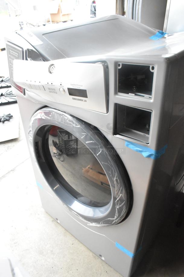 Crossover 2.0 DLHF0817EC2 metal front load dryer, 120-208/240V, 1 phase. New condition with protective wrap.