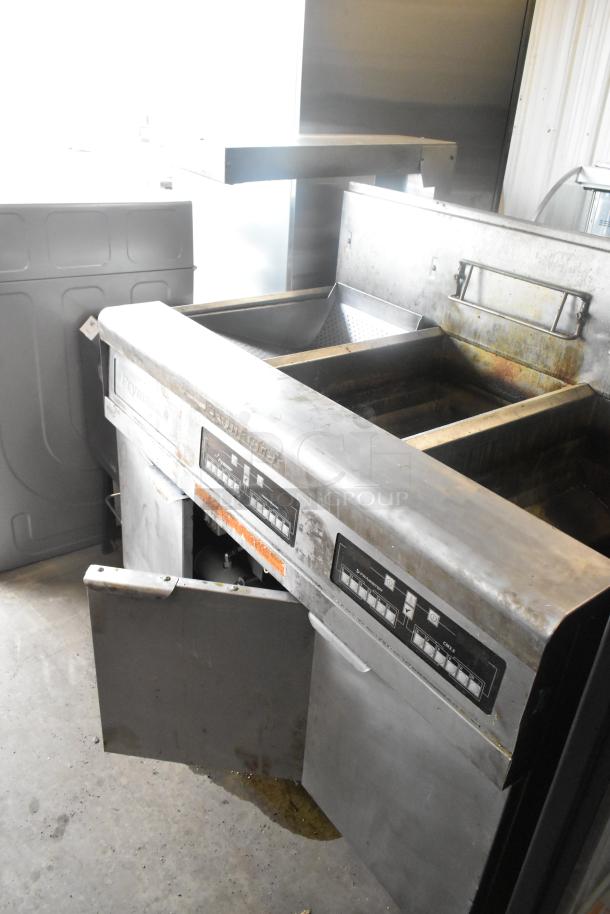 Frymaster FMPH255CSC stainless steel 2-bay deep fat fryer with dumping station, natural gas, 80,000 BTU, on casters.