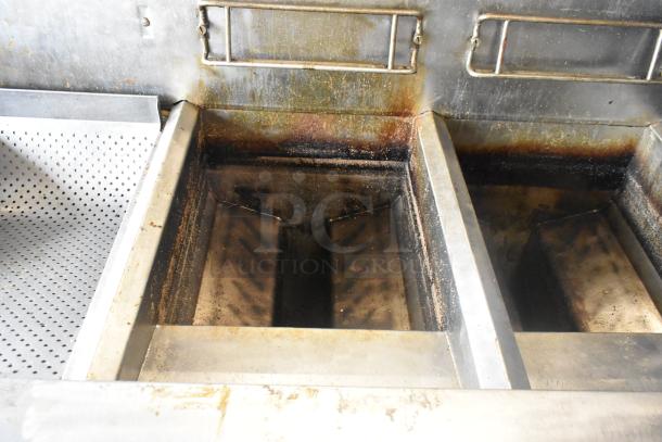 Frymaster FMPH255CSC 2-bay fryer with dumping station, stainless steel, natural gas, 80,000 BTU, on casters, used condition.