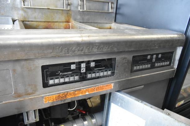 Frymaster FMPH255CSC stainless steel 2-bay deep fat fryer with dumping station, commercial casters, and control panel.