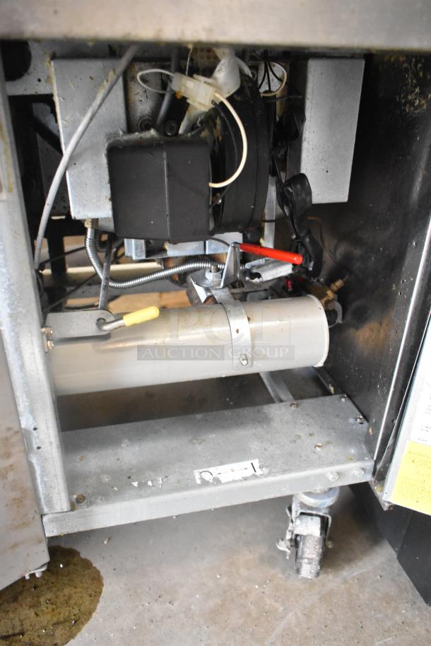 Frymaster FMPH255CSC deep fat fryer, stainless steel, natural gas, 80,000 BTU, two bays, on commercial casters, visible wear.