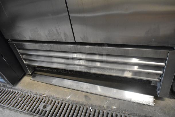 True T-35 stainless steel 2-door reach-in cooler with poly-coated racks. 115 volts, 1 phase, commercial use.