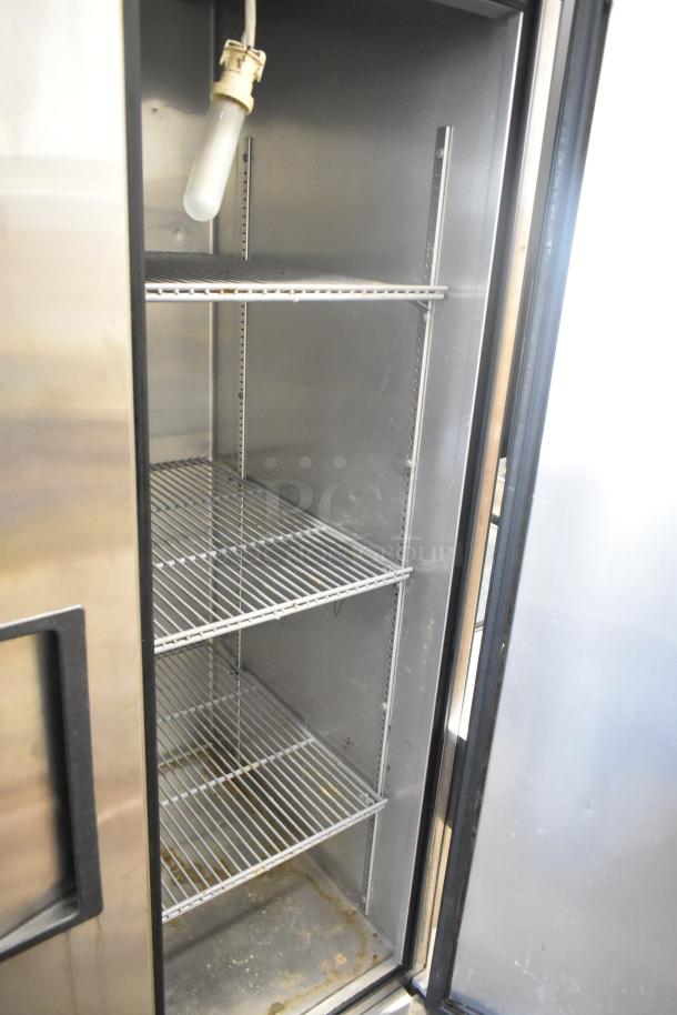 True T-35 stainless steel commercial 2-door reach-in cooler with poly-coated racks, visible interior light, 115 volts, 1 phase.