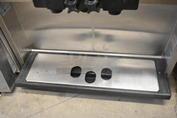 Electro Freeze 55TF-213 stainless steel soft serve machine with three spouts, used condition, 230V, 1 Phase.