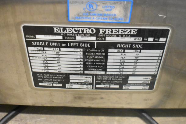 Electro Freeze 55TF-213 stainless steel ice cream machine label showing specifications for a dual-flavor unit, 230V, 1 phase.