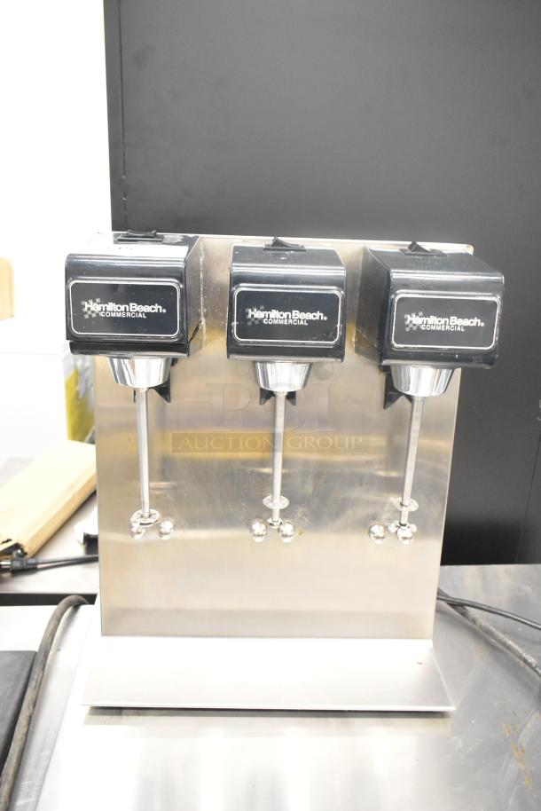 Hamilton Beach Model 950 stainless steel countertop 3-head drink machine, 120 volts, with visible branding and controls.
