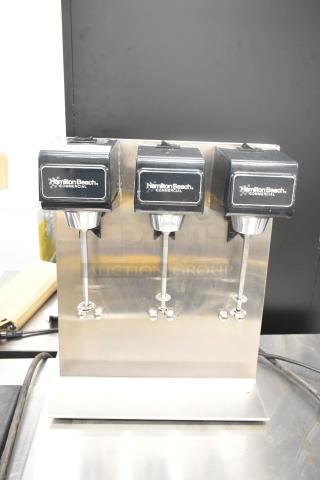 Hamilton Beach Model 950 stainless steel countertop 3-head drink machine, 120 volts, with visible branding and controls.