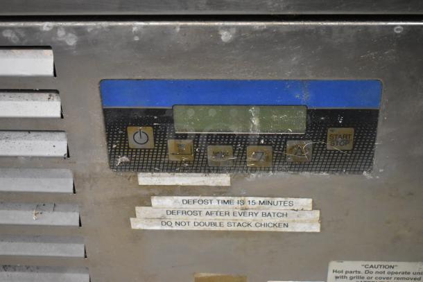 Standex BCF44244-0AX6 stainless steel blast chiller control panel. Features on/off button, defrost instructions visible.