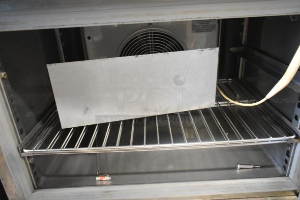 Standex BCF44244-0AX6 stainless steel single door undercounter blast chiller, visible interior with wire shelving, 220V, 1 phase.