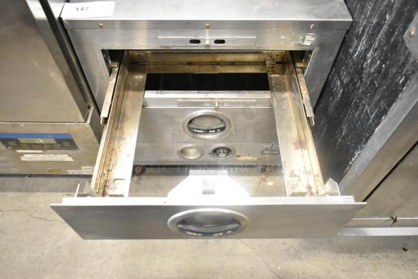 Toastmaster Stainless Steel Commercial 2 Drawer Warming Drawer, used condition, visible wear, model details seen on unit front.