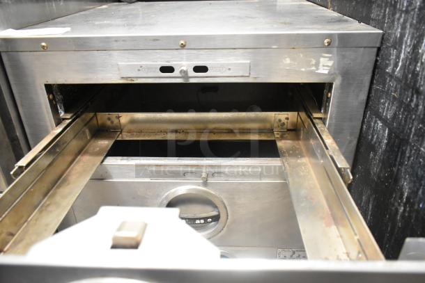 Toastmaster stainless steel commercial 2-drawer warming drawer, showing open drawers with crisp/moist settings. Moderate wear.