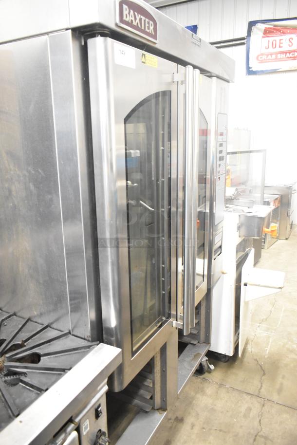 Baxter OV310G stainless steel commercial mini rotating rack oven on double pan rack with casters, in good condition.