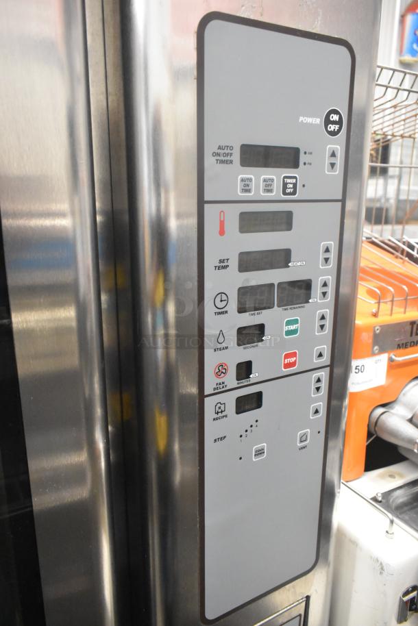 Baxter OV310G stainless steel commercial mini rotating rack oven, features control panel, on double pan rack with casters.