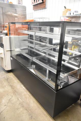 Black Avantco 193BCFD72B bakery display case, 70 7/8", LED lighting, commercial use, scratch and dent condition.