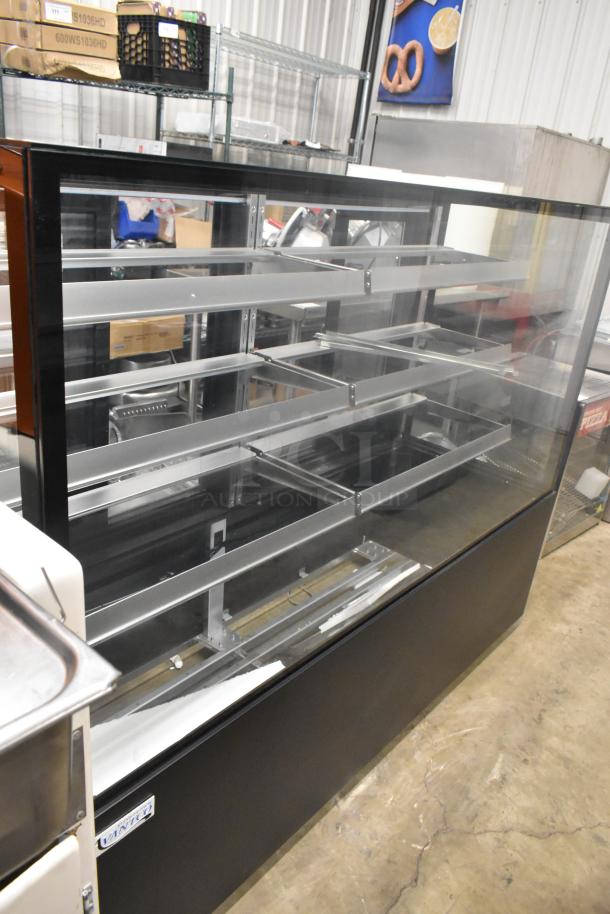 Brand new Avantco 193BCFD72B 70 7/8" black metal bakery display case with LED lighting; scratch and dent condition.