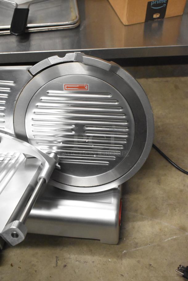 Brand new Avantco 177SL312 12" manual gravity feed meat slicer with blade sharpener. Features 1/3 hp, 115 volts, 1 phase.