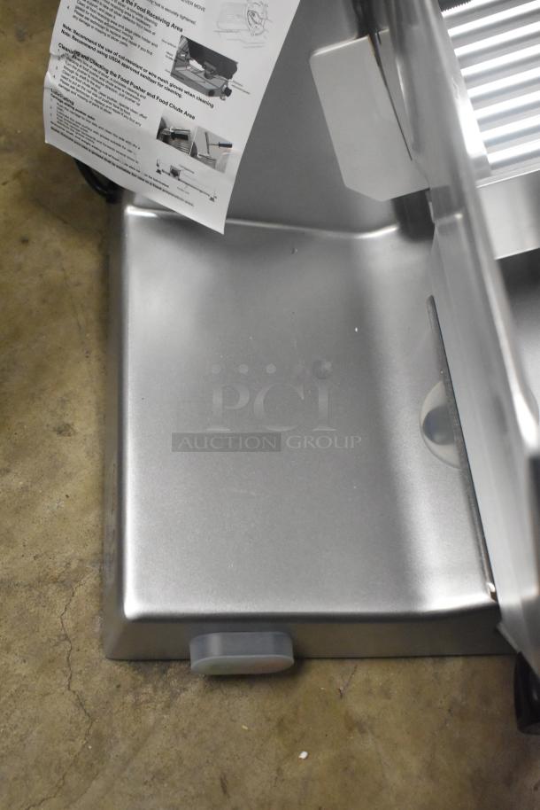 Brand new Avantco 177SL312 12" manual gravity feed meat slicer with blade sharpener, visible manual. 1/3 hp, 115V, 1 Phase.