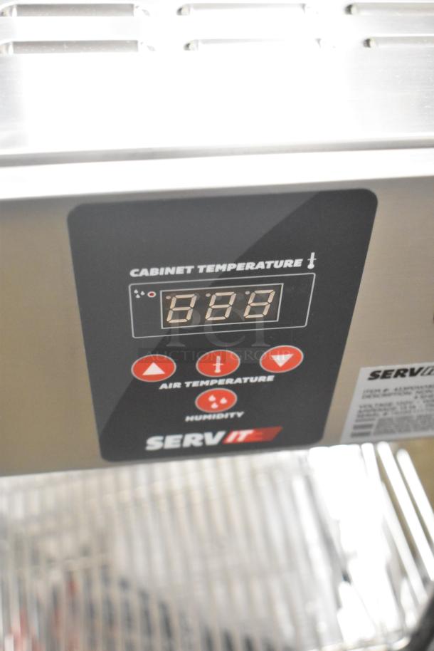 Brand new ServIt 423PDW18D2S display warmer, 18", 4 shelves, digital controls, 120V, minor scratches and dents.