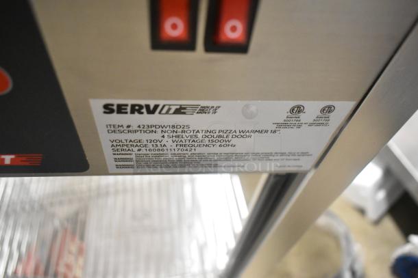 Brand new ServIt 423PDW18D2S 18" display warmer. Features 4 shelves, double door, 120V, 1500W. Label with specs shown.