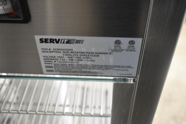 Brand new ServIt 423PDW12D1S 12" display warmer with 4 shelves, 120V, single door. Label shows specs and warnings.