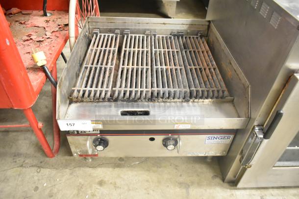 APW Wyott stainless steel commercial countertop gas charbroiler grill with dual knobs, visible signs of use, and label details.