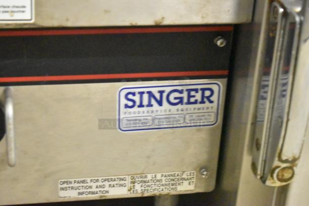 APW Wyott stainless steel commercial countertop gas charbroiler grill, featuring "Singer" food service equipment label.