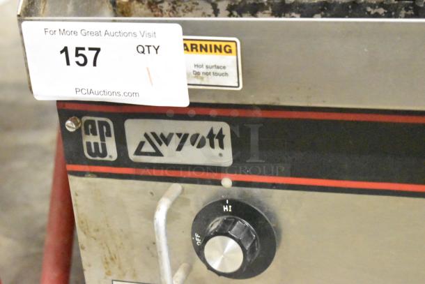 APW Wyott stainless steel gas charbroiler grill, countertop model, visible control knob, auction tag "157".