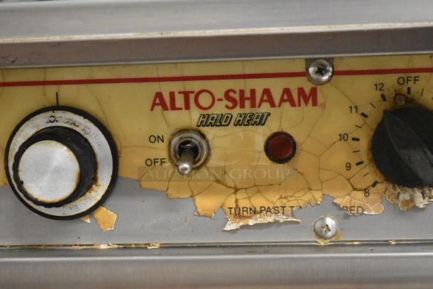 Alto Shaam stainless steel commercial cook-n-hold oven, features Halo Heat, visible wear on dial and label indicating usage.