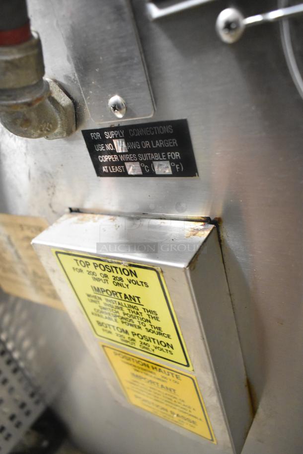 Alto Shaam stainless steel commercial Cook N Hold oven. Visible wiring labels indicate installation specifications.