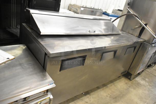 True TSSU-72-16 stainless steel sandwich salad prep table on casters, 115 volts, 1 phase, shown with closed top.
