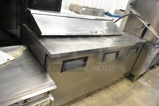 True TSSU-72-16 stainless steel sandwich salad prep table on casters, 115 volts, 1 phase, shown with closed top.