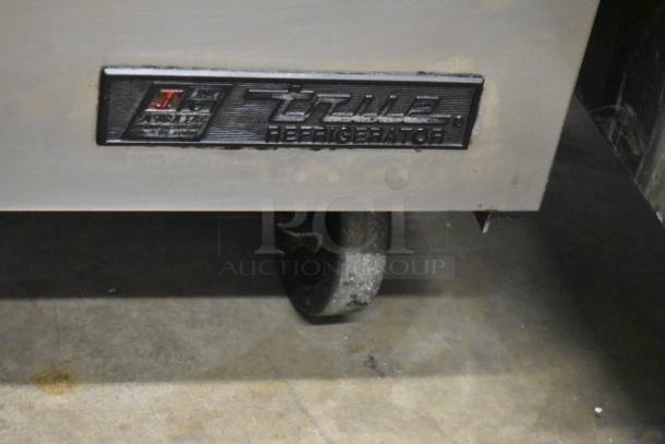 True TSSU-72-16 stainless steel sandwich prep table, on casters, label visible, indicating 115 volts, 1 phase.